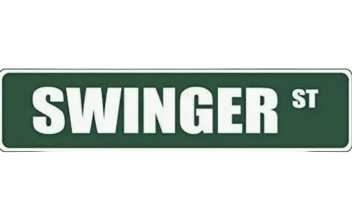 Street sign with 'SWINGER ST' text on a green background